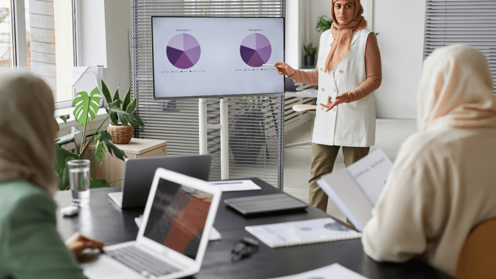 a person is giving a presentation in front of a group of people