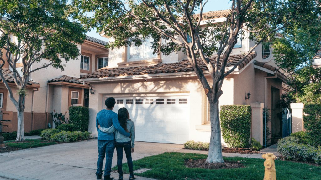 two person standing in front of house