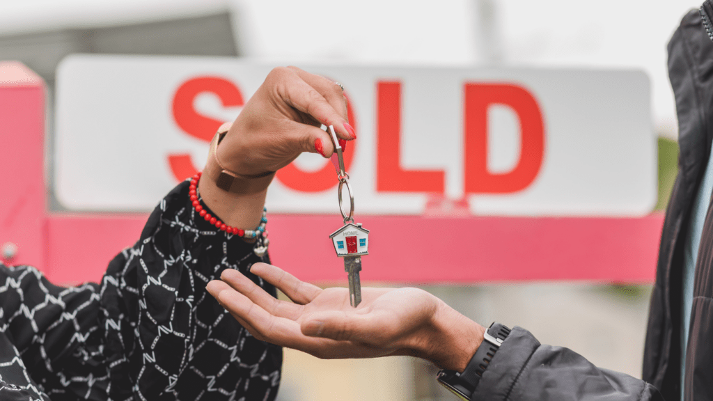 a person holding a sold key