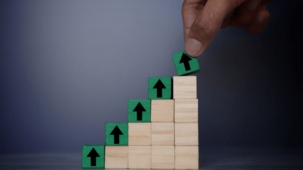 a person is placing wooden blocks with arrows on top of them