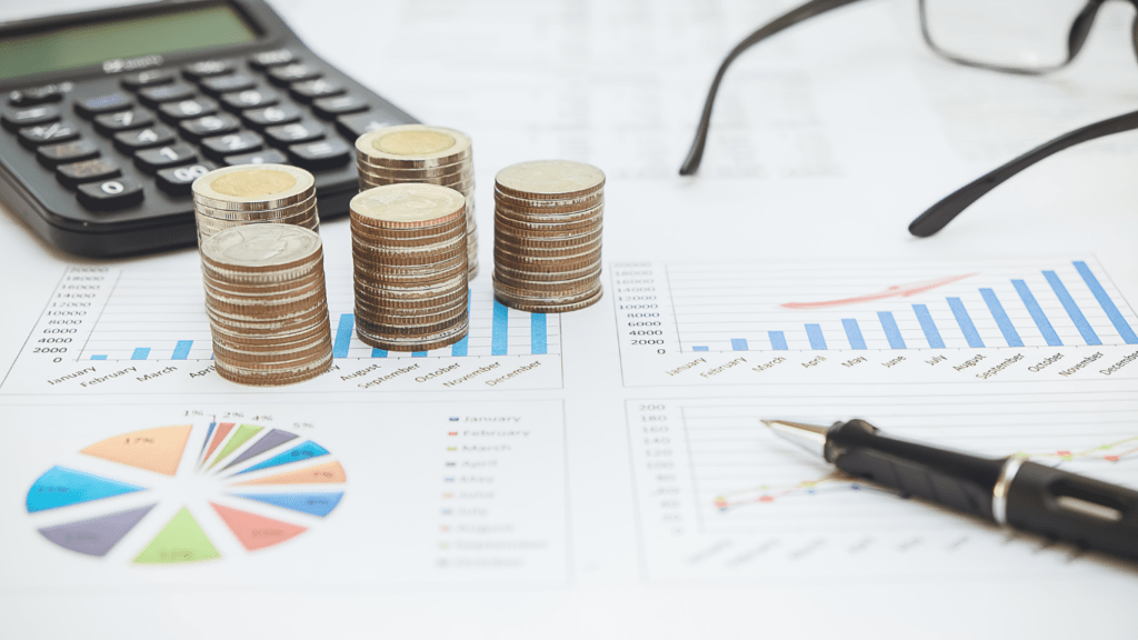 a stack of coins on top of a chart