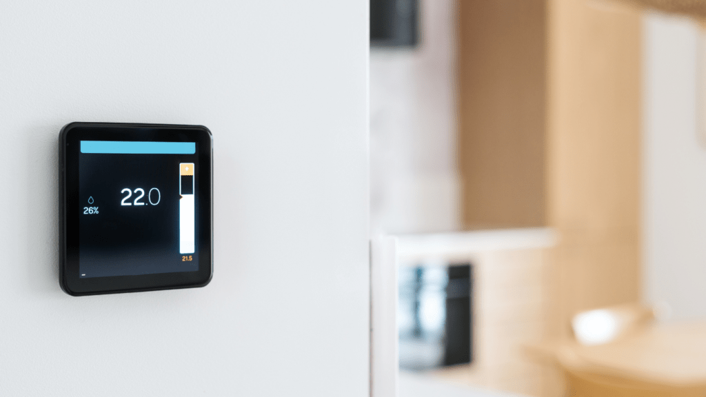 a digital thermostat mounted on the wall