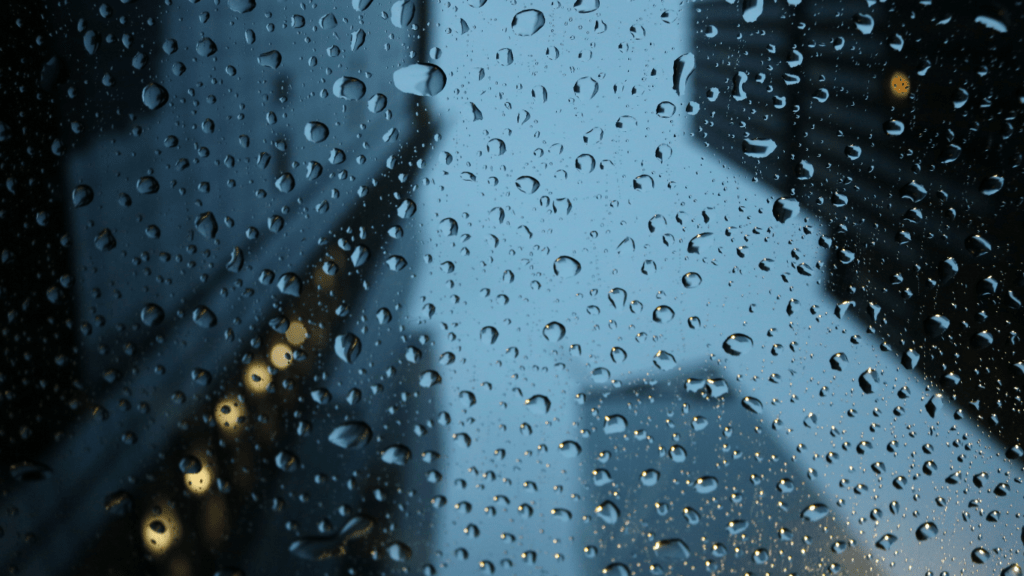 rainy city street with cars and traffic on a rainy day