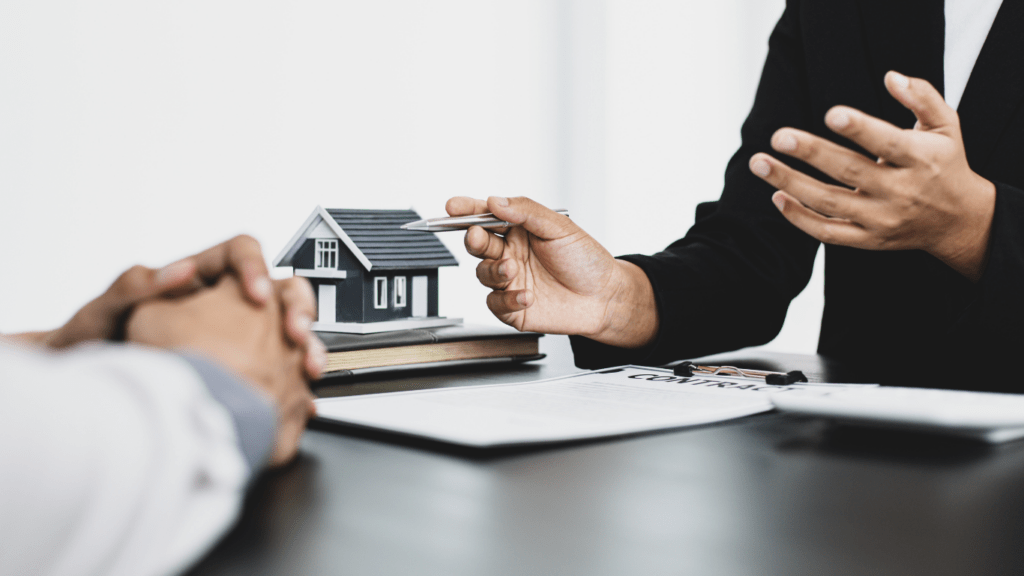 Real estate agent showing contract to client